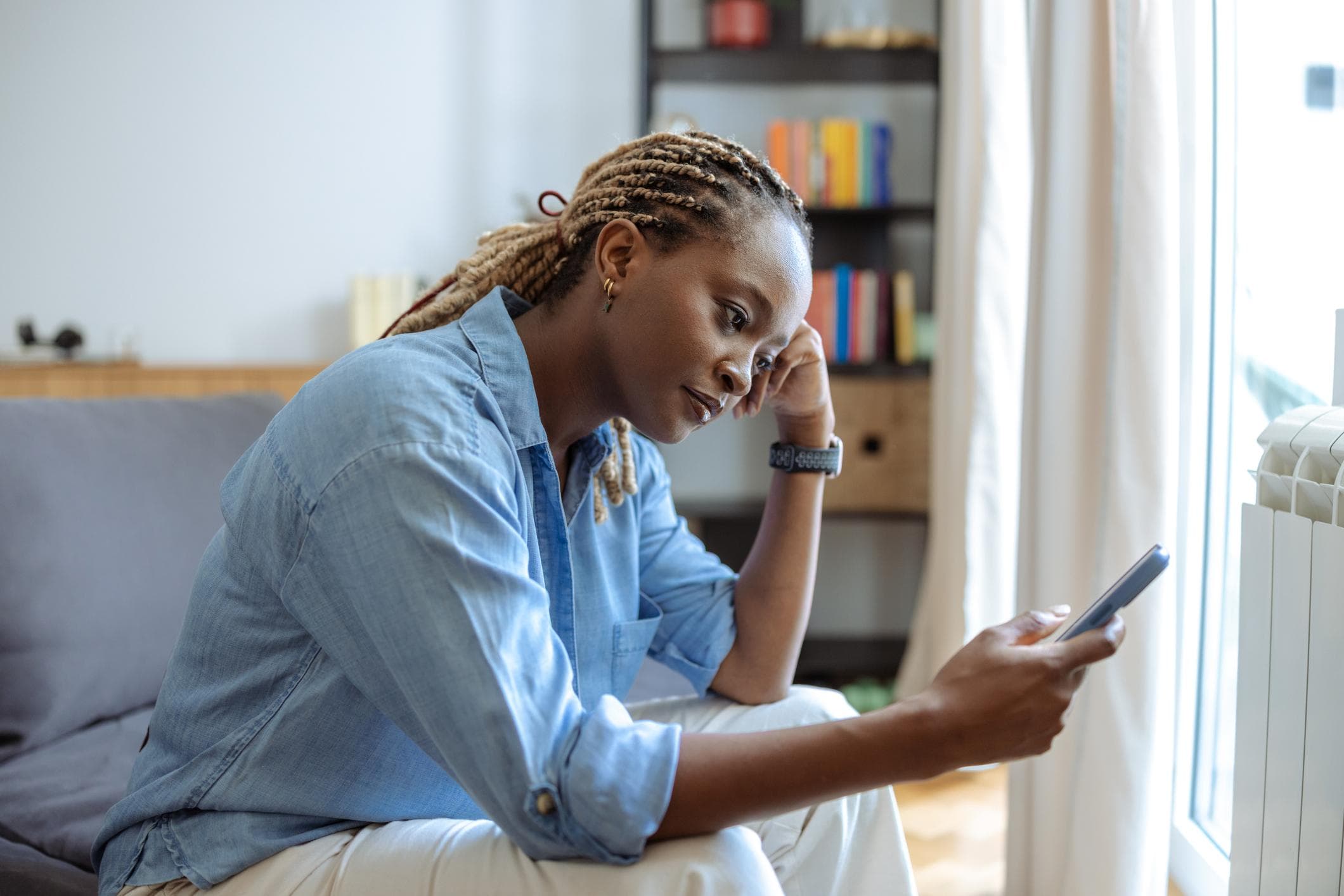 Person using a mood tracking app with a calm, supportive interface